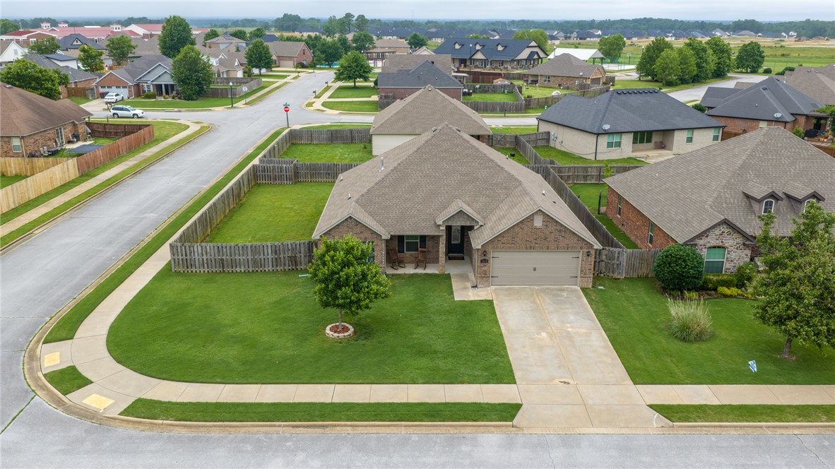 Welcome home to 7478 Bellgrove Ave in the highly desirable Legendary subdivision of Springdale! This beautifully maintained 3-bedroom, 2-bath home offers over 2,000 +/- sqft of comfortable living space with a functional split floor plan designed for both everyday living and entertaining. Situated on a spacious corner lot, this home features a large living area filled with natural light, formal dining space, eat-in kitchen with granite countertops, pantry, and abundant cabinet space. Recent updates including fresh paint make this home move-in ready. Step outside to enjoy the private fenced backyard and covered patio, perfect for relaxing or hosting guests. Conveniently located near Shaw Family Park, walking trails, shopping, dining, and all that Northwest Arkansas has to offer.  Don’t miss your opportunity to own this beautiful home in one of Springdale’s most sought-after neighborhoods!