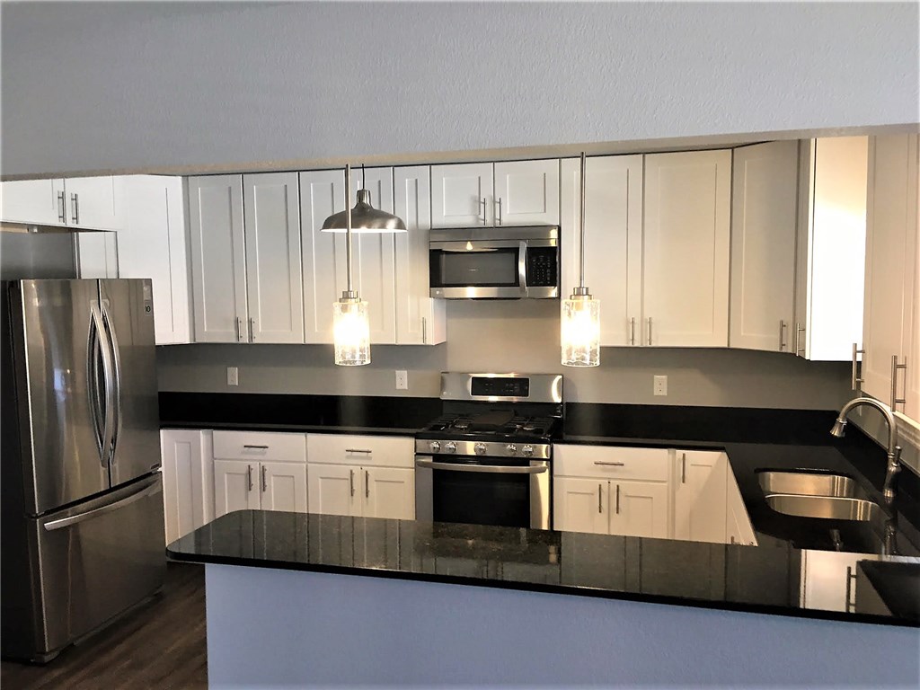 This Newly remodeled Upscale unit located in the heart of downtown Bentonville near the square is a definite must See!! This unit features Stainless Steel appliances as well as a gas cook top with designer grade cabinets with easy close assist hinges throughout. Large very functional rooms with lots of closet space! LAWN CARE IS INCLUDED