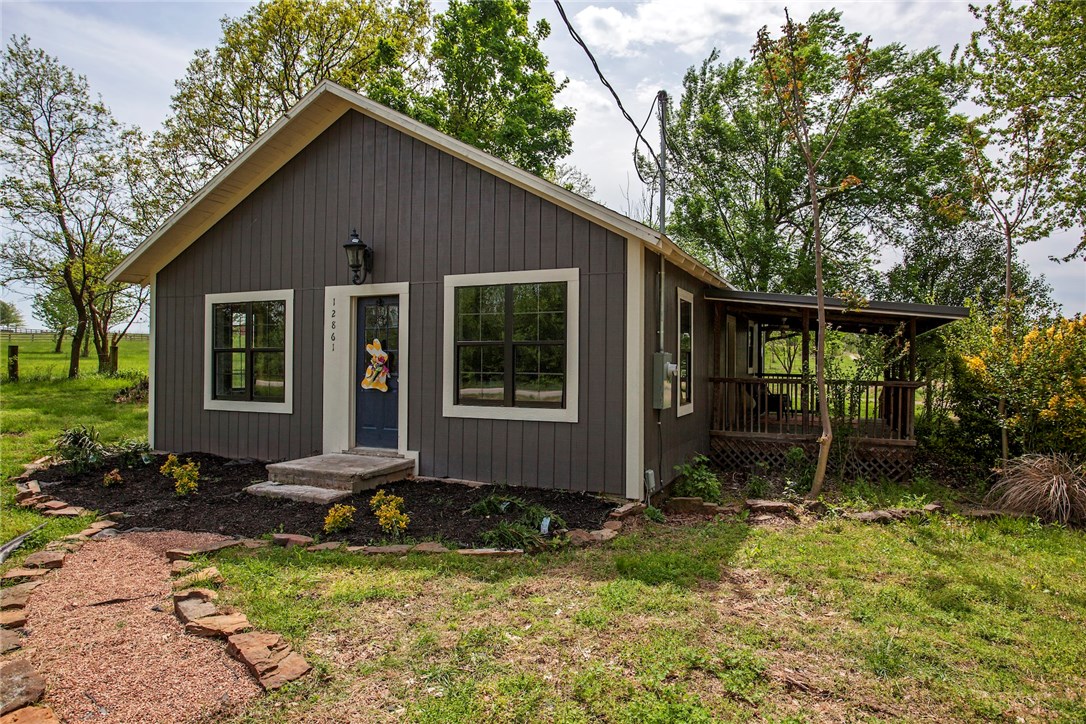 This newly remodeled quaint little country home has a lot of historical charm!Original hardwood floors and cabinetry. New roof, windows, Hardie board trim, Masonite siding and HVAC.New tile in all wet areas and stainless steel appliances.This 1.6 has easy access with additional electric at back of property,room for live stock and this property also features a 500 sq ft metal shop.