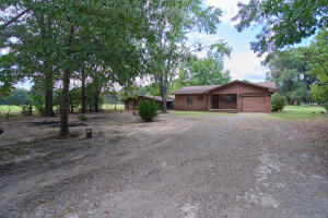 An affordable country home! This quaint little farmhouse is approximately 1007 square feet and has 2 bedrooms, 1 large bathroom, laundry room, kitchen, breakfast area, and one car garage. Sitting on approximately 1.39 acres, the home also features a shop with concrete floor and electrical service, along with a large attached covered workspace, all for under $100,000!