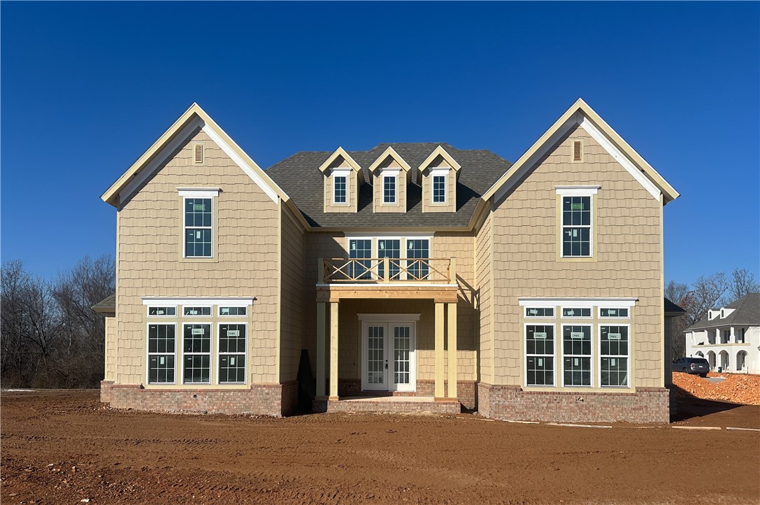 Welcome to this new single-family home in Fayetteville’s peaceful Blackberry Ridge, designed by Lane Crosno Designs. Upon entry, you'll enter the living area and be greeted by a two-story ceiling. To your left is the open kitchen and dining room, and to your right is the master bedroom. Through the living area leads onto the covered back patio with a courtyard. The kitchen features an island, quartz countertops, and Cafe appliances. Engineered hardwood floors extend through the main areas including downstairs bedrooms and stairs. The owner’s suite offers a walk-in closet, and spa-like bath with dual vanities, walk-in shower, freestanding tub, and private water closet. Upstairs, you’ll find three bedrooms and two additional bathrooms. The split three-car garage is prewired for an EV charger, and the covered porch has a natural gas line and CAT6 hookup. *Agent Owned*