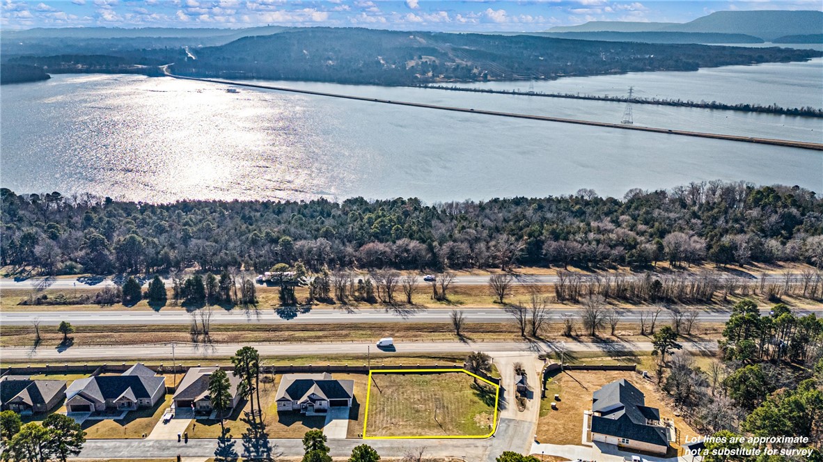 Owner Finance Available 7.5 % Interest. 
Build your dream home on this 0.33-acre cleared lot in the desirable Pleasant View Estates subdivision. This ready-to-build property offers stunning, unobstructed views of the Arkansas River and is located within a gated community, providing privacy and peace of mind. Surrounded by beautiful, mature trees, the setting is both scenic and serene. An ideal location for a custom home, this lot combines natural beauty, privacy, and convenience in one exceptional offering.