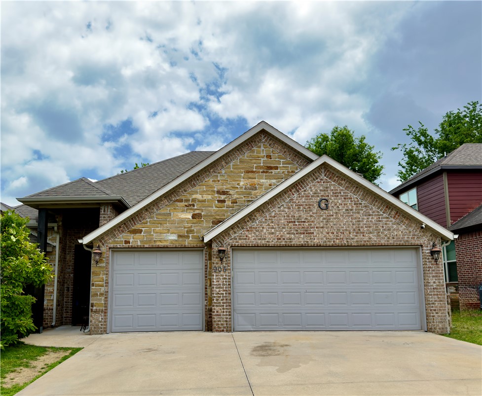 Beautifully designed 2-story home in Kerelaw Castle subdivision! This 4-bedroom, 3-bath home offers 2,363 sq ft of thoughtfully planned living space with quality finishes throughout. Enjoy an open living area with a cozy gas log fireplace and detailed trim work. The kitchen features granite countertops, ample cabinetry, a breakfast bar, a breakfast nook and a functional layout ideal for everyday living and entertaining. The spacious primary suite includes a whirlpool tub, walk-in tiled shower, and multiple closets for exceptional storage. The 4th bedroom can be office if needed. New carpeting in bedrooms and stairs! Energy-efficient geothermal heating and air system provides year-round comfort with lower utility costs and a reduced environmental footprint. Additional highlights include a 3-car attached garage and a fully fenced backyard with mature shade trees perfect for relaxing or hosting. Conveniently located near schools, shopping, dining, and all that Bentonville has to offer.
