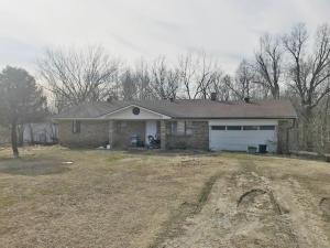 3 bedroom 2 bath brick home on 2 acres. Needs to be overhauled. Has been rental for past several years. About 1 1/2 mile off Hwy 412 on McDonald Rd. CH&A, fireplace with insert. sqft per assessor.