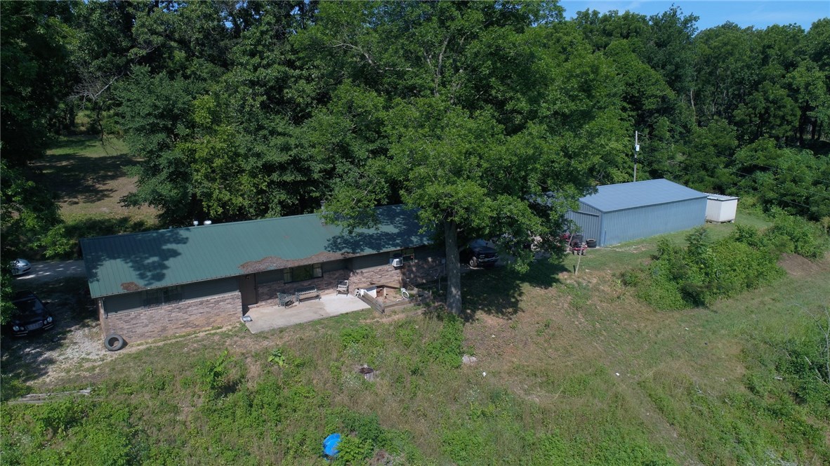 Want room to roam?  This is the place for you with 10 acres and a 3 bed 2 bath home with outbuildings.
Great location out of town but convenient to conveniences of town and I-49. Public sewer and water available soon. See it today!