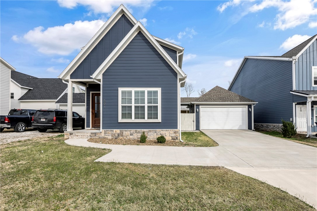 This stunning home in downtown Rogers offers an unbeatable location near entertainment, schools, fine dining, and scenic trails. Inside, you'll find a spacious living room filled with natural light and an open floor plan. The modern kitchen features sleek modern cabinets, quartz countertops, stainless steel appliances, a large island, pantry, and eat-in area. The primary suite on the main level boasts LVP flooring, a luxurious ensuite with double sinks, a walk-in tile shower, and a large walk-in closet. Upstairs, three spacious bedrooms with LVP flooring and walk-in closets surround a cozy landing area. A detached garage provides ample storage, while the patio is perfect for entertaining! Great investment opportunity, with its desirable location, modern features making it an attractive option for both personal enjoyment and financial gain.