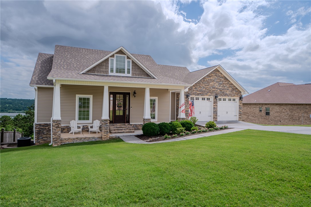 Set inside gated Pleasant View Estates, this 4 bedroom, 3 bath home offers the kind of views that make the location hard to forget with beautiful views of Russellville, Lake Dardanelle, and Mt. Nebo. With 2,667 heated and cooled square feet, the home features an open, split floor plan, eat-in kitchen, main-level living, and a finished walkout basement with additional living space. Step directly outside to a private inground pool, spacious patio area, and large lot designed for relaxing, entertaining, or simply enjoying the setting. Additional features include a safe room, attached two-car garage, and generous storage throughout. Located less than 1 mile from multiple boat ramps and within 6 miles of Lake Dardanelle State Park, this property combines comfort, privacy, views, and access to some of the best outdoor recreation in the Russellville area.
