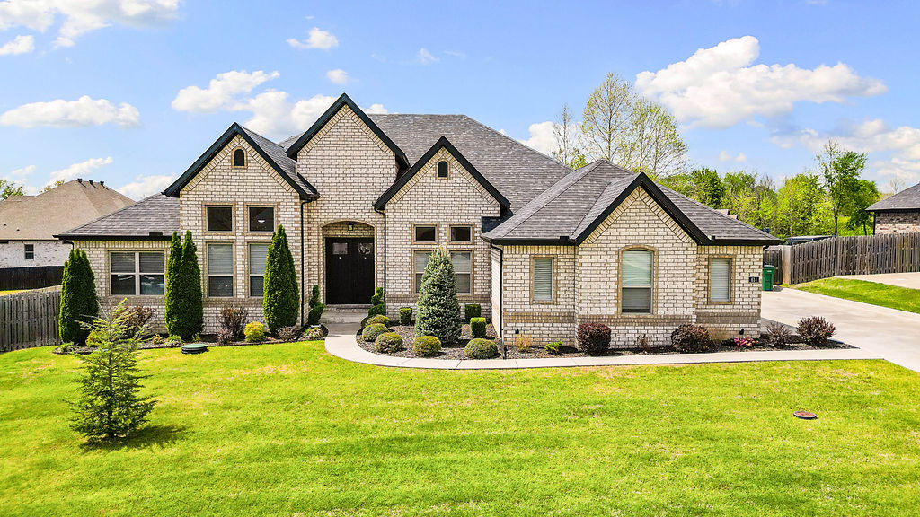 Beautiful 4-bedroom, 3-bath home on a spacious half-acre lot in the Elm Valley subdivision, located in Elm Springs! Built in Fall 2020, this like-new property offers modern finishes and thoughtful upgrades throughout. Enjoy a private backyard with serene nature views, enhanced by professionally installed privacy trees. The extended concrete patio is perfect for entertaining and features custom motorized solar shades and an outdoor fireplace for year-round enjoyment. A Jellyfish™ lighting system on the front exterior adds customizable ambiance, perfect for Christmas, and provides effortless curb appeal year-round. The main level offers multiple living spaces, including a formal dining room and a dedicated office, providing flexibility for both everyday living and entertaining. Additional features include a 3-car garage and central vacuum system, all set in a very serene and peaceful neighborhood.