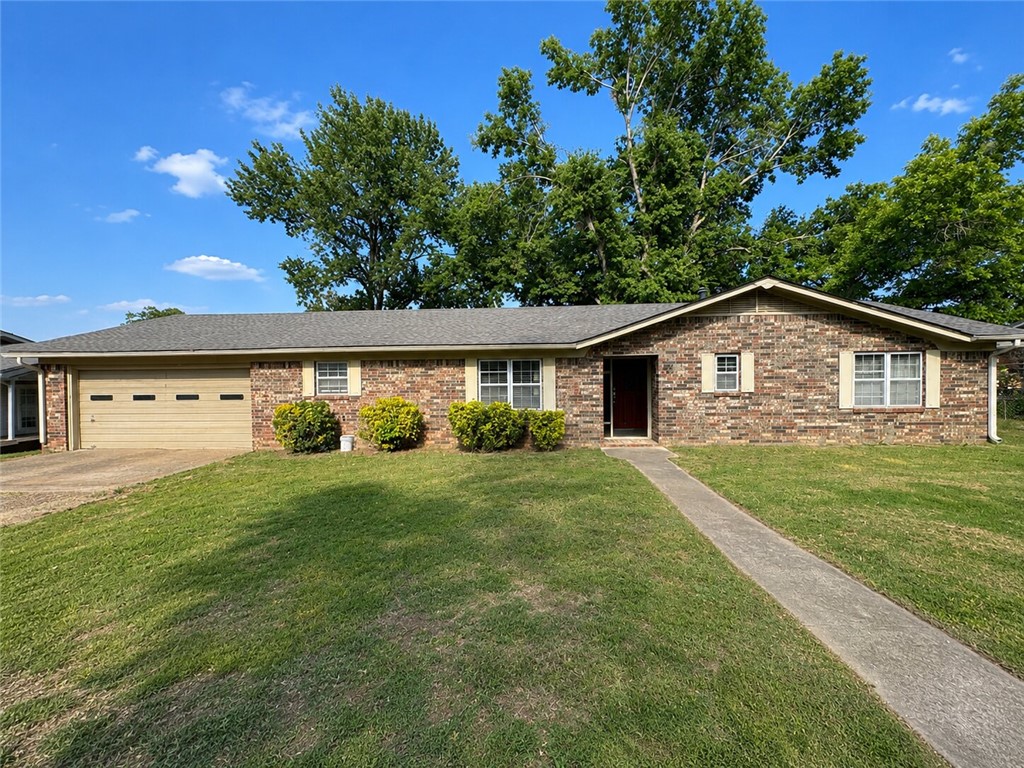 Beautifully updated 3BR/2BA home w/a separate heated and cooled office off the garage—perfect for working from home, hobbies, or extra flex space! Inside you’ll find all new luxury vinyl tile flooring, fresh paint, updated fixtures, and a spacious living area centered around a cozy brick fireplace. The kitchen features a new dishwasher, disposal, and sink along with great cabinet space and an open feel for everyday living and entertaining. Both bathrooms have been remodeled, giving the home a fresh, modern look while maintaining its character. Additional features include gas heat installed in 2019, two electric water heaters, and a laundry room with utility sink. Step outside to enjoy the fully fenced backyard with plenty of room to play, garden, or entertain, plus a screened-in covered back porch ideal for relaxing year-round. Move-in ready with numerous updates throughout!