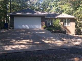 Level lot; 3 bedroom All Brick exterior; front yard is low maintenance rock. Well kept; fresh paint. Floors are carpet, wood & ceramic.  Large deck for entertaining; wired for hot tub, door from master bedroom to deck. Home previously had wired surround sound and alarm system.  Wiring still there; current owner can provide location(s) to buyer if needed. Roof replaced 2012, hot water tank 2 years old. A/C serviced regularly.  Home Warranty.