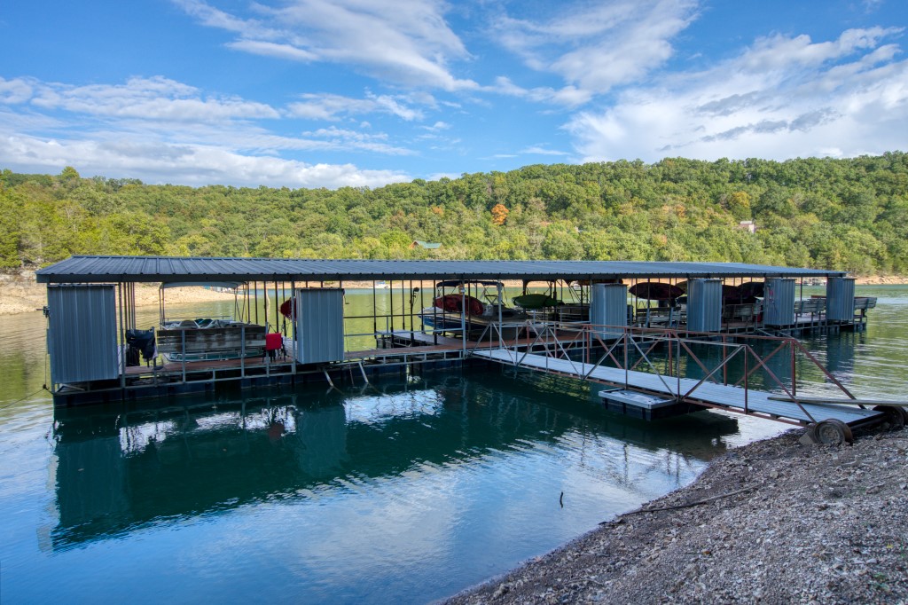 This great Beaver Lake view lot would be an excellent place to build and a 20’ community dock slip and new boat lift are included! The dock slip is located in this subdivision so a long drive isn’t necessary! This lot offers a flat front yard and a lake view that could be opened up with some tree clearing. Electricity is at the street and community water is available. This lot is accessed on paved roads and is easy to get to, while still feeling private!
