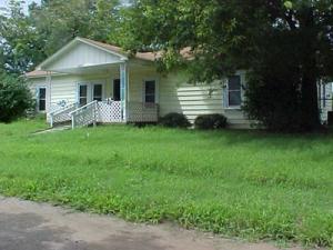 Property would make a good home with some TLC. Storm cellar, chain link fencing, detached garage/shop, private location and a great price! This property is now under auction terms.   All auction assets will be sold subject to seller approval. Property is occupied and there is no access to see the interior. Property cannot be shown while occupied.