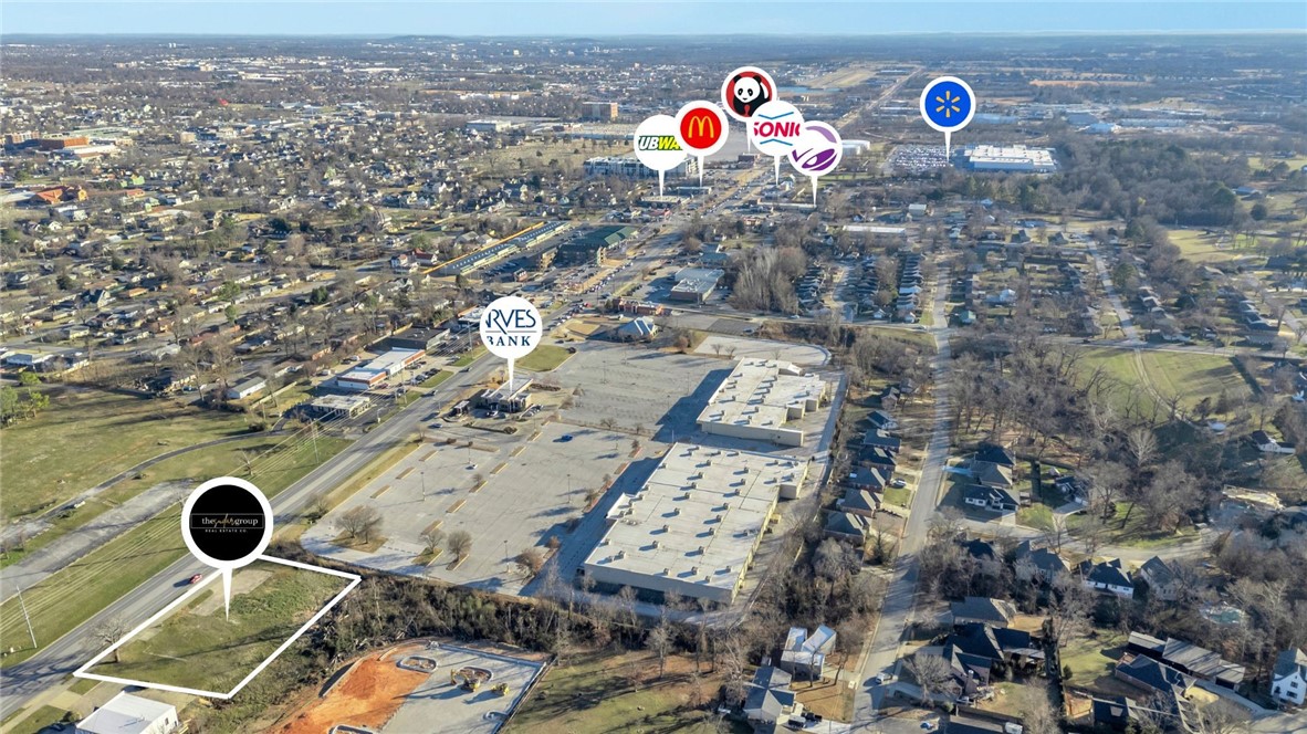 High-visibility Bentonville development opportunity on Walton Blvd (Hwy 71B) with 40,000+ vehicles passing daily. This offering includes two parcels totaling approx. 0.57 acres, sold together only, creating a deeper footprint for redevelopment. The front parcel (01-00878-000 | approx. 0.33 acres) provides direct Walton Blvd frontage and strong exposure. The rear parcel (01-00888-000 | approx. 0.24 acres) sits directly behind and adds space for parking, storage, expanded building footprint, or flexible site planning (subject to zoning/city approval). A structure previously existed on site and utilities have historically served the property (buyer to verify availability, capacity, and connection fees). Surrounded by major employers, retail, restaurants, and the regional trail system, this is a rare opportunity to secure Walton Blvd frontage with additional depth in a high-traffic corridor. Property cross listed under land MLS  1333212