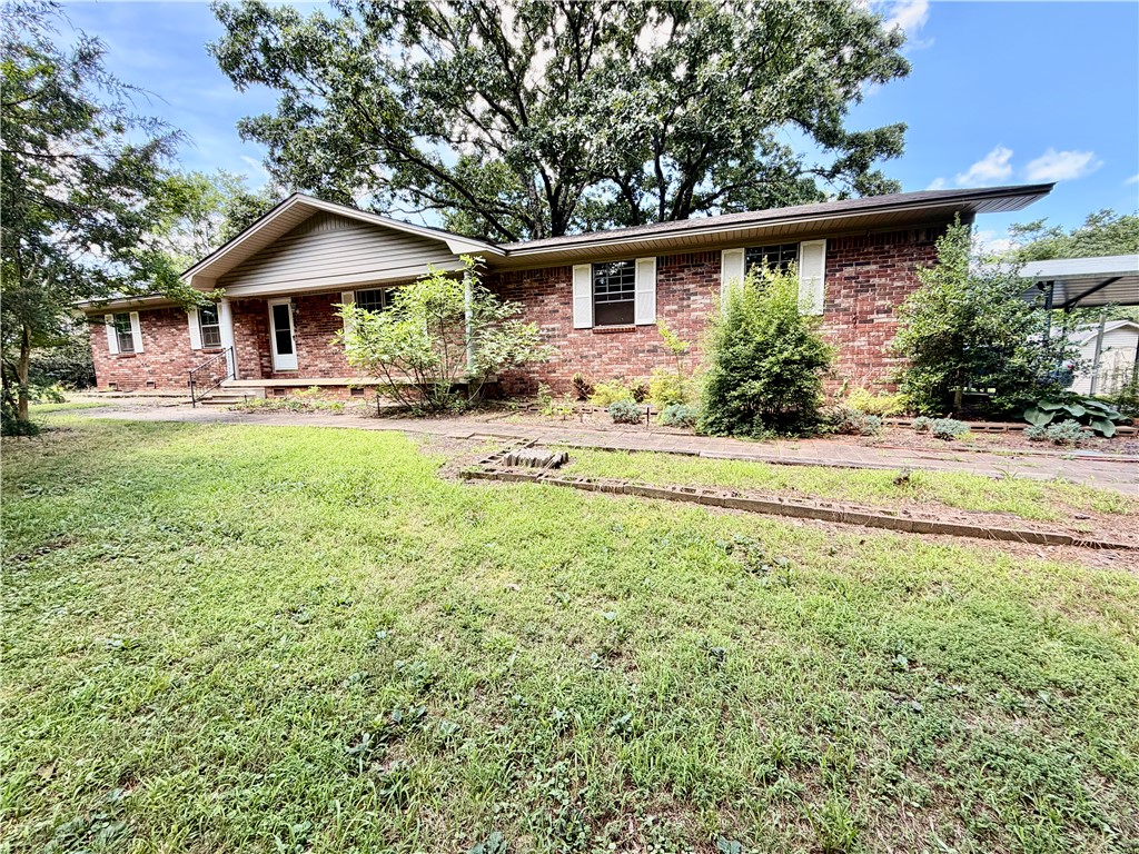 Nestled on approximately 2 acres, 1309 Old Highway 124 offers the perfect blend of country charm and convenience. Surrounded by open space and mature trees, this property provides plenty of room to enjoy outdoor living, gardening, recreation, or future possibilities. Located just minutes from Russellville, you'll appreciate the peaceful setting while maintaining easy access to shopping, dining, schools, and everyday amenities. Whether you're looking for a place to call home or a property with room to grow, this acreage offers endless potential in a desirable location.