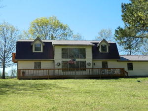 This is a large family home. It has a formal dining, cathedral ceiling with loft area, great place for the kids to have their own space. Nice bedrooms with huge closets for storage.  Formal dining room, and large master with master bath. The view of the mountains and location being very near the lake make it a home that you can feel as though you are on  vacation everyday!  New storm shelter.