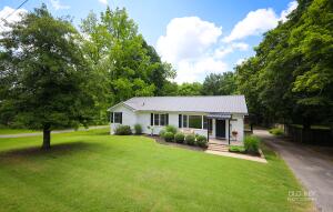 This 5 bedroom 3 bath house with over half an acre of landscaped grounds, epitomizes luxurious living. Indulge in the sleek kitchen, unwind in the serene master suite, and gather in the spacious living areas. The lower level offers a game room, bedrooms, laundry, and storage. Outside, a sprawling backyard, a large shop, and a charming playset await. Discover the pinnacle of elegance, convenience, and modern upgrades.
