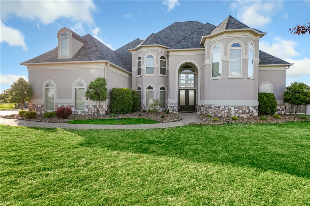 Welcome to your Next Home! 11896 Lakenheath Drive—a spacious and beautifully designed home on 0.86 acres in one of Bentonville’s most desirable areas. With 4,737 sq ft, this home offers flexible living with two main-level living rooms, a guest half bath, and a private primary suite with a spa-inspired bath and oversized walk in closet. The open kitchen offers generous storage and seamless flow for everyday living or entertaining. Upstairs features an additional en-suite bedroom w/ full bath ideal for multigenerational needs, plus three more bedrooms, a 2nd full bath, a dedicated office, and a large bonus/media room. Step outside to your private backyard retreat with a heated and cooled gunite saltwater pool. A rare 4-car garage adds both convenience and storage. This home blends comfort, space, and functionality in a prime location near top-rated schools, trails, and Bentonville amenities