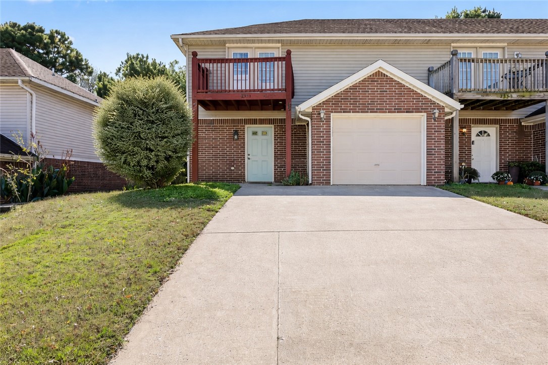 Conveniently located just 1.8 miles from the University of Arkansas, this spacious 2-bedroom, 2.5-bathroom townhome offers comfort, convenience, and easy living. The home features a wide driveway with ample parking and a welcoming entryway. Inside, you’ll find a great living room with fireplace, a large kitchen with an eat-in dining area, perfect for everyday meals or entertaining guests. Each bedroom includes its own private en suite bathroom, offering privacy and comfort for residents or guests alike. The primary bedroom also boasts a private balcony, ideal for enjoying your morning coffee or relaxing in the evening. Step outside to a large, fully fenced backyard, providing plenty of space for pets, outdoor activities, or simply enjoying the fresh air. With bike and walking trails nearby, this home combines peaceful living with easy access to campus, shopping, and dining. Whether you’re looking for a primary residence, student housing, or an investment opportunity, this property checks all the boxes.