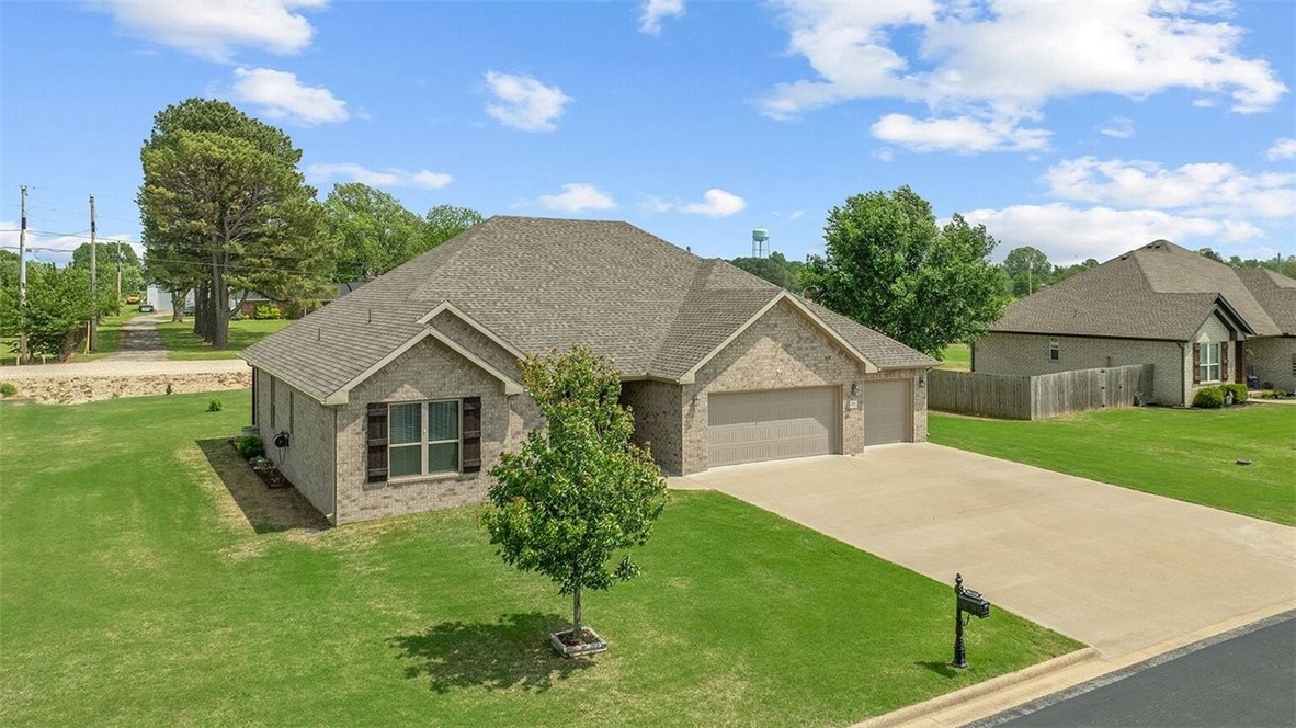 Welcome home to this beautifully well maintained home in a quiet neighborhood.  Enjoy the split floorplan with an open living, kitchen, and dining area. The kitchen features granite countertops with eat at counter space and ample cabinets and pantry.  The living room has a fireplace for those cold evenings that is anchored by built in shelving. Granite countertop throughout and a large laundry space.  Enjoy quiet time on the front or back covered porch. Storage building in backyard conveys with the home. This home is ready to call your own!