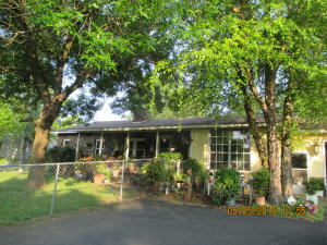 Lots to like! Lg 2 BR with room for 3rd, country style brick & rock ranch on 2.5 acres. Big pantry, big kitchen, lots of room. Heat/ac new in 2013, DW & microwave new last year, Pergo floor in living room, New roof 2015, greenhouse, shed, 30x50 metal building with overhead & 220 service, metal carport, over-sized 2car garage, and lots of potential. Additional lot avail. Minutes from Bayview Dev.