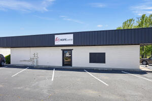 This 7,200 sq ft building has 13 rooms that could be used as offices.  There is a nice conference room and kitchen area. make use of part of it and rent the other out!Come and see how this will work for you!