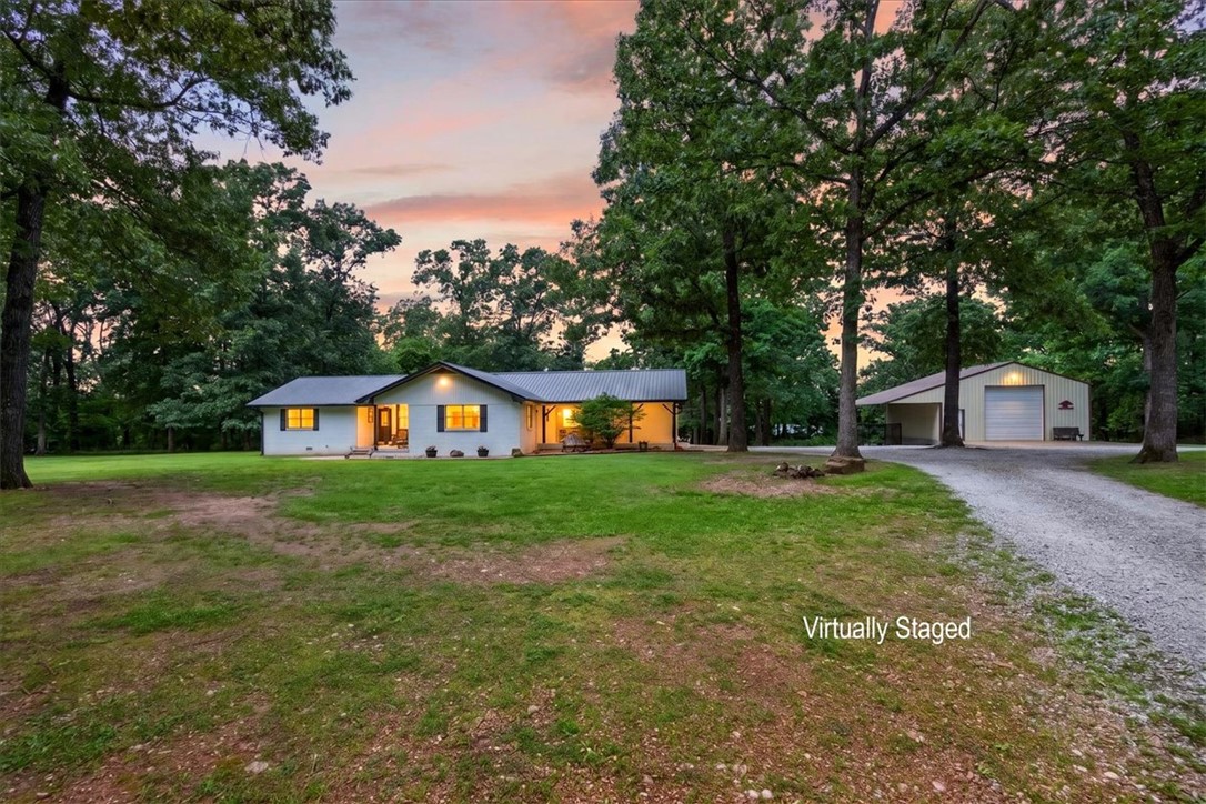 Some homes simply feel like the place where memories are meant to be made. From summer afternoons spent splashing in the pool to evenings watching the fireflies on your very own 7 acres, this charming property offers the kind of lifestyle many dream about.

With 4 bedrooms, 3 bathrooms, and two private primary suites with separate exterior entrances, there’s room for family, guests, and changing seasons of life. The insulated shop with oversized door and pole barn provide endless space for hobbies, equipment, animals, or business needs. Conveniently located yet surrounded by room to roam, this property strikes the perfect balance between comfort, function, and country charm.