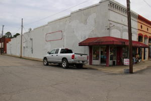 Own a piece of Atkins HISTORY! This was Elmo Haney's Pharmacy. Now is Junker's Junction flea market. LARGE retail space with TWO storage/warehouse spaces. NEW HVAC in 2018. Several booths rented out to vendors and approximately $5K-$7K of inventory conveys with building, including the historic safe, dated 1890's! UNLIMITED possibilities in downtown Atkins.
