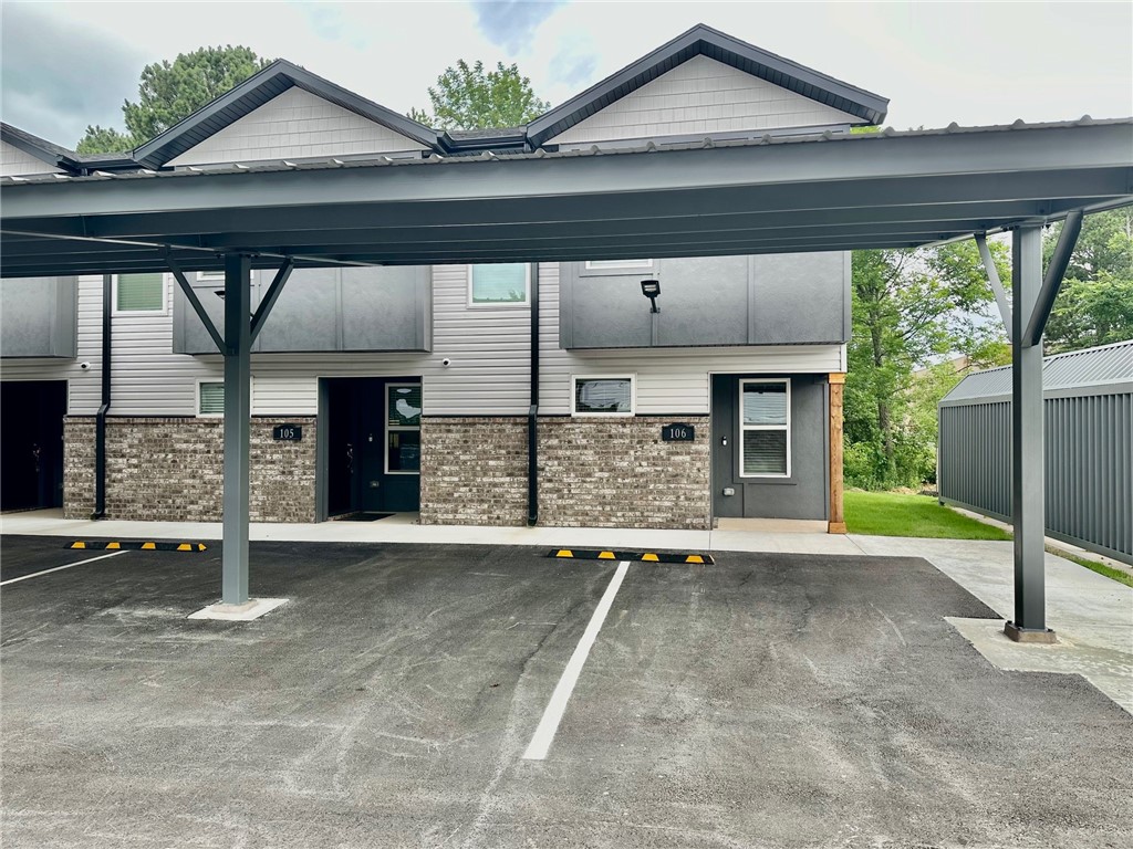 New Construction townhome in a perfect Fayetteville location. Close to the U of A, shopping, trails, I-49 and all NWA has to offer! 2 beds, 2.5 baths, 2 car garage. Large main floor for living area, laundry, 1/2 bath and kitchen. Bedrooms are located upstairs with private baths. LVP flooring in main areas, carpet on stairs and in bedrooms; ceiling fans in bedrooms and living room area. Kitchen has all stainless appliances. Refrigerator and full-size washer & dryer are included. Bluetooth speaker system in living area and on covered porch; Wi-Fi cameras for security. Located along UA bus route 35. Lawn care Provided.