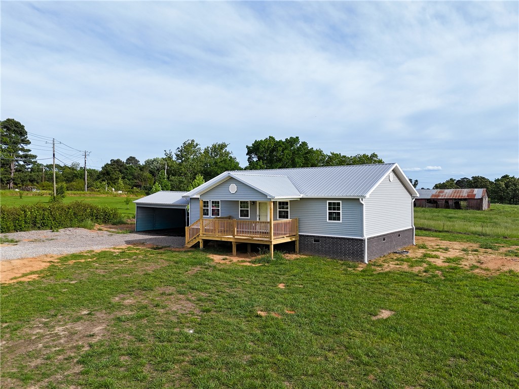 This new construction home offers 3 bedrooms and 2 bathrooms on a 1.16-acre lot, combining rural living with the convenience of a short drive to town. This home also features a 2-car carport. Inside, you’ll appreciate the split floor plan, designed for both comfort and privacy. The home features stylish finishes, modern flooring, and an abundance of natural light that enhances the bright, open living space. A clean, neutral color palette provides the perfect canvas to make it your own. Don’t miss the opportunity to make this home yours, schedule your private showing with me today!