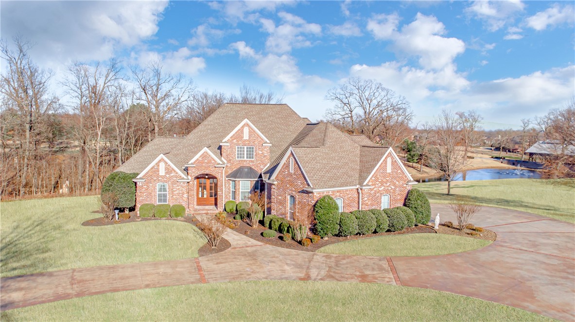 This nearly 3 acre estate offers unobstructed views of the Stonebriar iconic wood bridge and fountained pond.  A covered deck overlooks an expansive flat lawn with woods offering privacy to the north – plenty of room for play or a pool! With TWO master suites and an office on the main level, plus 3 bedrooms on the second level, the versatility of usage is endless. A three car garage provides space for a workshop or boat/toy parking. Custom wood cabinetry, hardwired surround sound, and an 18 zone irrigation system are just a few of the many features of this exquisite home.  If you have been searching for a property that truly has it all – you have found it here in the luxurious Stonebriar community!
