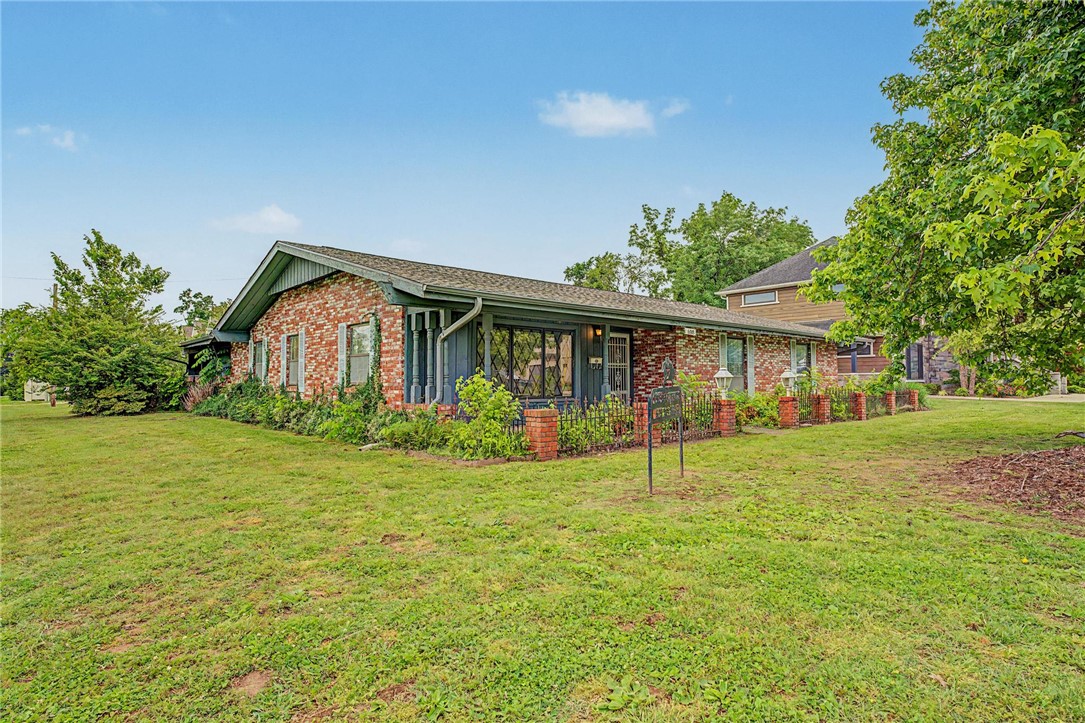 608 NW B St offers an exceptional location in the heart of Bentonville just minutes from Downtown, Crystal Bridges, and the Slaughter Pen trail system. Situated on a desirable corner lot with alley access, the property offers added flexibility and strong long-term potential for future expansion, redevelopment, garage access, or additional improvements.

This well-maintained home has had only two owners and has been cared for over the years, including a newer roof installed in recent years. The flat backyard features mature perennial landscaping and plenty of usable outdoor space.

Whether you’re looking for a primary residence, investment property, or future build opportunity, it’s hard to beat this location and lot in one of Bentonville’s most desirable areas.