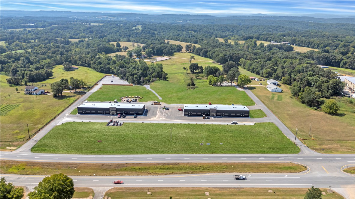 Two multi tenant NNN flex space centers in east Springdale, Arkansas are available for acquisition. The two buildings each total 11,998 square feet (23,996 SF in total) and combined are currently 84% leased, with four suites available for lease up. All tenants operate under NNN leases with minimal landlord responsibilities. The current rent is $279,660 with 19 tenants but there is a potential rent of $333,660, if the 4 vacant units are filled at their listed rates. The adjusted NOI is $320,844, when considering the vacant units. The site spans 5 acres and sits along Highway 412 with approximately 19,000 vehicles per day.