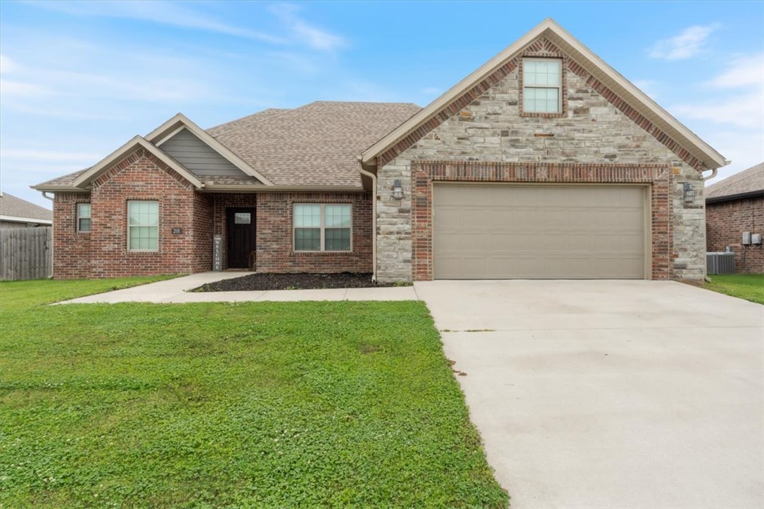 This beautiful brick and stone home is 2,137 sq. ft. of comfortable living space with a desirable split floor plan. The spacious owner’s suite features double sinks, a tiled walk-in shower, jetted tub, and an amazing walk-in closet. The kitchen offers stainless steel appliances, granite countertops, and crisp white cabinetry, both a eat in kitchen and a large formal dining. All 3 bedrooms are on the 1st level with the bonus room on the 2nd. A bonus room provides endless possibilities—home office, playroom, workout space, or second living area. Enjoy the covered back patio with privacy fencing great for perfect family cookouts or relaxing with your morning coffee. Sellers are also giving a 1 year home warranty at closing. This home is 15 minutes from XNA, and 30 minutes to Bentonville/ Rogers.