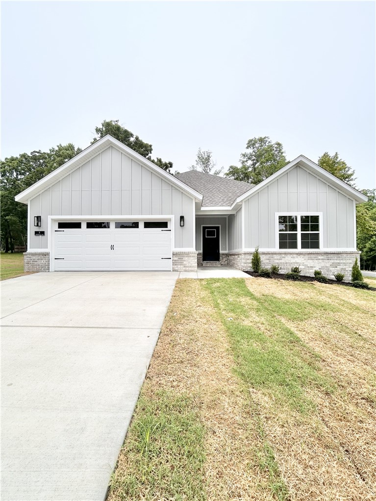 New construction on a flat .35 acre cul-de-sac lot just down the street from Branchwood Recreation and Nature Trail! Also located within close proximity to Highlands Golf Course, Lake Loch Lomond, and I-49. Step inside to discover an inviting open concept design featuring 10’ ceilings and beautiful floors that enhance the spacious feel of the home. NO CARPET. The stylish kitchen is equipped with a gas range, 3 cm quartz countertops, custom cabinets, and a walk-in pantry. Entertain or unwind in the living area, complete with a stunning fireplace, or step out onto the covered patio to enjoy the peaceful surroundings. The primary suite features a massive walk-in tile shower and closet. 2 bedrooms + office. Buyer can also receive $3,500 in closing costs when using the builder's preferred lender!