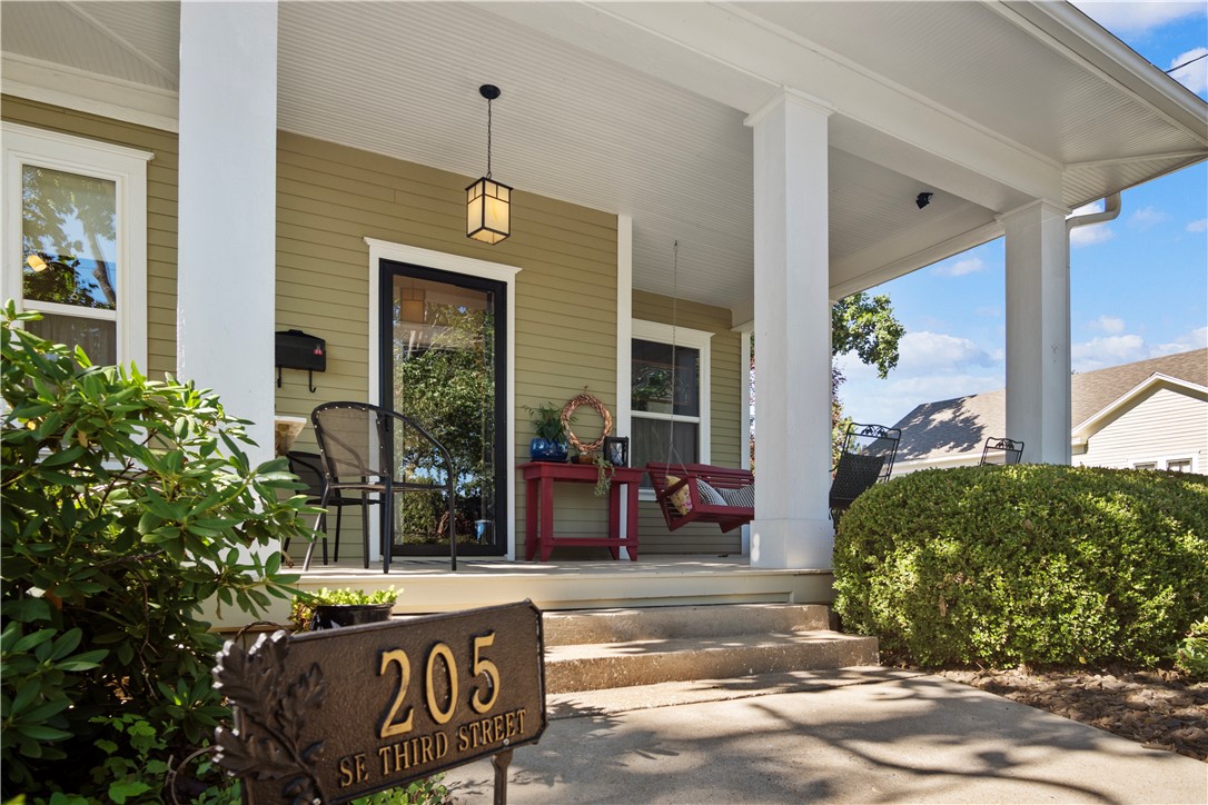 Live. Work. Play. Imagine living where you love and playing where you live. This is a rare opportunity to buy a piece of Downtown Bentonville history in the heart of the Historic 3rd Street District, just steps from the Downtown Square, The Ledger, The Momentary, the new Walmart campus, Crystal Bridges and the new Quilt of Parks currently being constructed (https://bentonvillear.com/1210/The-Quilt-of-Parks). Just off the corner of SE 3rd and A St. this recognizable home with its large front porch and famous red porch swing provide an amazing opportunity for work/life balance. Built in 1920 and once the residence of the Compton family, this home was thoughtfully remodeled in 2010 to preserve its historic charm. It features original hardwood floors repaired and refinished, lath and plaster walls, exquisite wood moldings, and a beautifully refinished corner brick fireplace and mantel. This home is bathed in natural light and makes coming home to Downtown Bentonville delightful!