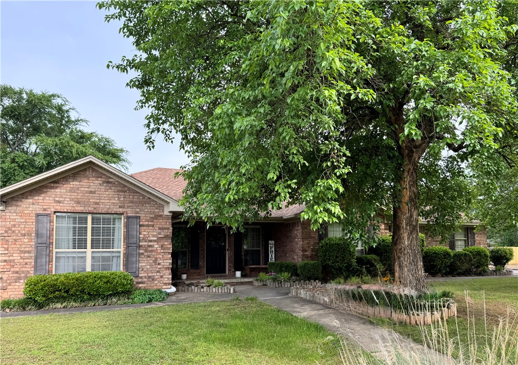 Welcome home to this 4 bed, 2 bath brick ranch that perfectly blends classic curb appeal with a modern, functional layout. This home features an inviting front porch & a side-entry 2-car garage,offering a clean and polished look.
The floor plan is open & split designed for privacy and flow. 
  The expansive living room features high ceilings and a cozy fireplace, creating an airy yet warm atmosphere. The large kitchen is functional with extensive cabinet storage, pantry and sprawling countertops ideal for meal prep. For those needing flexibility, the formal dining room can easily transition into an office, den, or playroom.
  The primary suite is complete with a generous walk-in closet and a beautiful walk-in shower.
   Step outside to find a backyard built for entertaining. The covered patio is the perfect spot for grilling, kids, pets & friends.
   Practicality meets hobbyist needs with a detached shed—perfect for a workshop & extra storage. Peace of mind is built right in, with an on-site storm shelter.