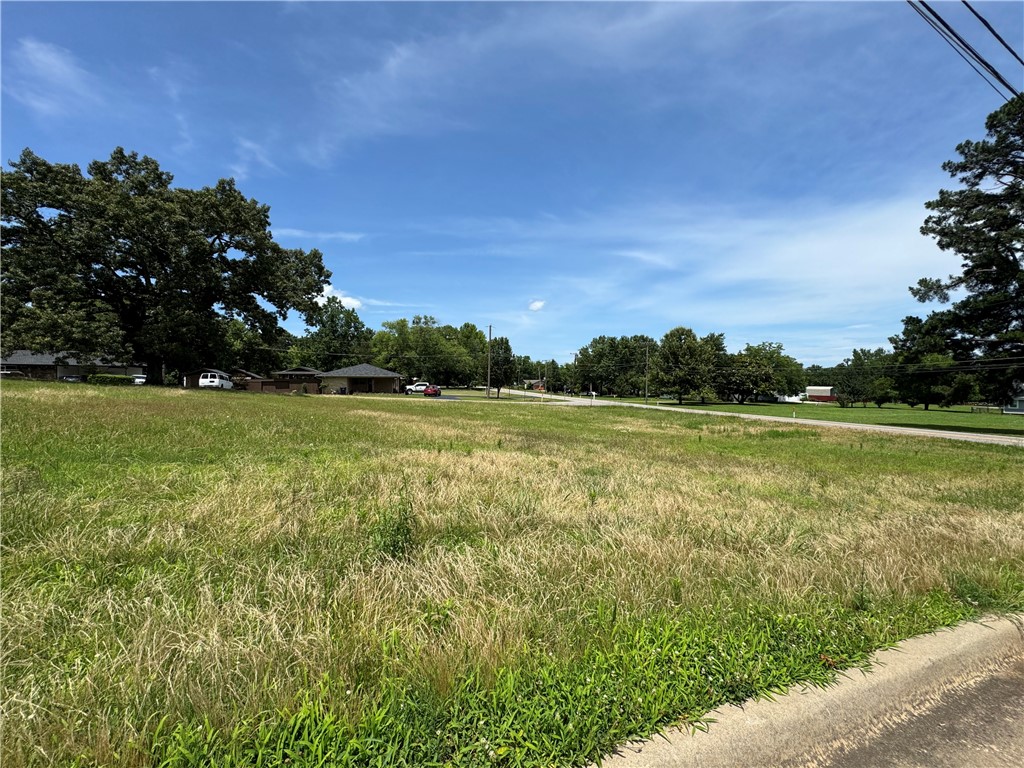Currently zoned residential, this attractive lot—just under an acre—is ideally situated adjacent to commercial property. With strong potential for rezoning, it offers a prime opportunity for future development."