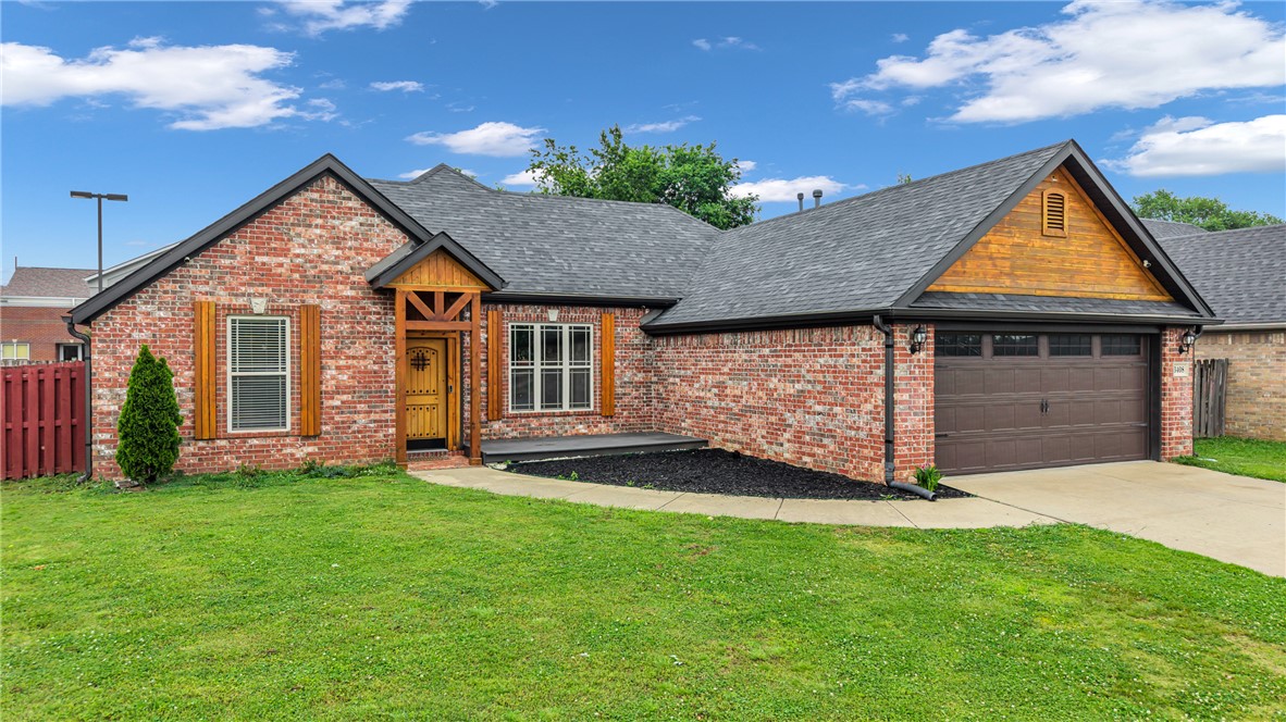 You guys, you need to see this! This adorable 4-bedroom, 2-bath brick home in Springdale's Westfield neighborhood is literally perfect if you commute anywhere in NW Arkansas. You're right off I-49, so getting to Bentonville, Rogers, or Fayetteville is a breeze — no more stressing about drive time! The neighborhood is established and so well-kept, with great schools nearby and everything you need just minutes away. Inside, the split floor plan gives everyone their own space, the gas fireplace is cozy, and the wood floors are gorgeous. The kitchen flows right into the dining room, which you know you needed for hosting! The primary suite has a huge walk-in closet, and there's even a bonus room for a home office. The backyard is fenced and private — perfect for your dogs. Seriously, 1,627 square feet, a 2-car garage, and all of this for $355,000. In THIS market? You won't believe it. Come see it — you'll want to make an offer on the spot!