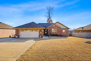 Welcome to 250 Redwood Lane! This charming 1,841 sq ft, 4-bedroom, 2-bathroom brick home is located in the sought-after Shiloh subdivision, known for its quiet & desired neighborhood. Built just 7 years ago, the home seamlessly blends a cozy American cottage aesthetic with modern updates.Enjoy the open-concept split floor plan filled with natural light from large living room and kitchen windows. The kitchen features granite countertops, an island with seating, and ample storage, perfect for entertaining or daily living. The primary suite includes his-and-hers walk-in closets, while the oversized guest bedrooms offer deep closets, with one ideal for a home office.Step outside to the fenced backyard with a deck and enjoy the outdoor space. This home is complete with extra concrete par