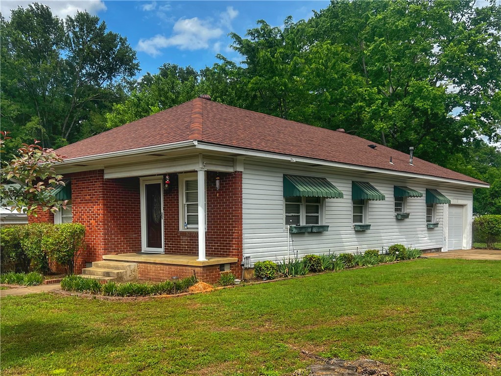 A real charmer located within walking distance to Arkansas Tech campus.  3 Bedrooms, each with a cedar lined closet.  Lovely backyard with a surprising amount of privacy.  Hardwood floors throughout.  Updated kitchen and bath, heated garage with Electric Vehicle Charger. Ample sized laundry room.  Don't miss out on this gem!