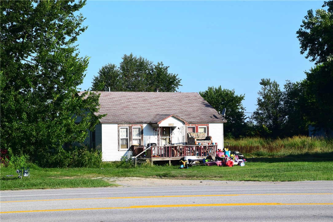 SOLD AS-IS. 2 rent houses and 1.2 acres. 1 rental is 500/month & the other rental is $400/month. Property has 396 ft of Hwy frontage on Hwy 62. Currently zoned as agriculture w/improvements. Could possible be rezoned as commercial. Would also make a great investment property w/a little TLC