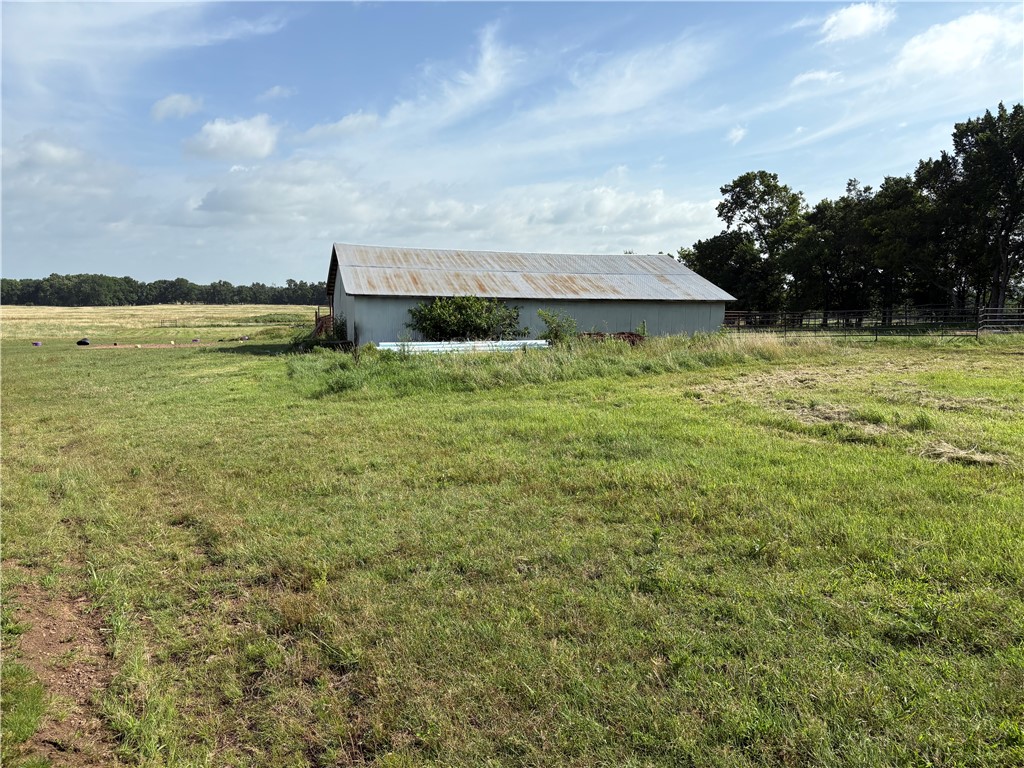 Beautiful 91.75 acres all in one field has barn and corrals. Prairie Grove main water line crosses the property from Prairie Grove Lake to Prairie Grove. Has 2 water taps installed on property. Blair Creek runs along edge of property and a few acres in flood zone in NW corner of property. Only about 2 miles from Prairie Grove bypass. Build your dream home and have a horse or cattle ranch and still be close to everything.