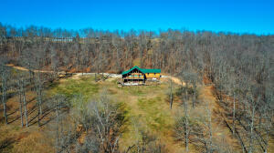 This log home with its spectacular view is a three level custom built log cabin which is also meticulously clean and well maintained. The home features a large master closet and tile shower, gas fireplace, granite counter tops, balcony, sunroom, 2 living areas. Square footage approximate