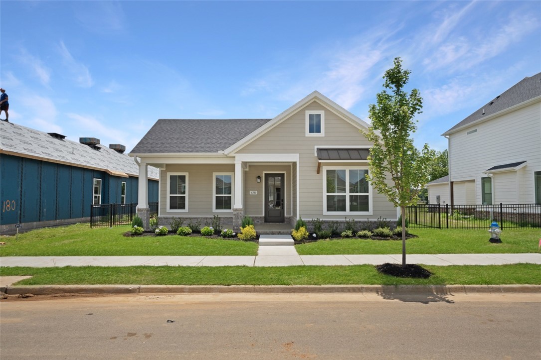 The Holly is a stunning single-story home where thoughtful design meets effortless modern living. The inviting living room centers around a cozy fireplace and flows seamlessly to a covered patio and beautifully landscaped side yard — perfect for relaxing or entertaining.

The open-concept kitchen overlooks the family room and features an oversized island with extra seating, a generous pantry, and ample space for a dining table — making it as functional as it is welcoming. Tucked privately at the rear of the home, the owner's suite is a true retreat, complete with a spacious walk-in closet and a gorgeous en-suite bathroom.

With a maintenance free yard and direct access to a nearby park with scenic trails, The Holly offers the rare combination of comfort, convenience, and tranquility. This isn't just a home — it's the backdrop for the life you've been imagining.