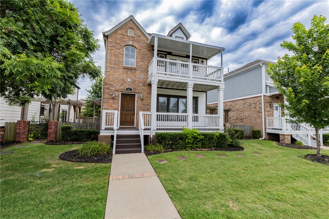 U of A parents and investors take notice of this opportunity to purchase one of the iconic Fayetteville Rupple Row homes!  This family-owned home has housed 2 kids through college and is ready for the next owner.  These houses have plenty of living area downstairs with a half bath for guests, an adorable outdoor area, and a 2-car garage with alley entry.  There's PLENTY of additional parking spaces on the street out front.  All the bedrooms, full baths, and laundry are upstairs.  The primary suite is on the front with a large ensuite, including shower, jetted tub, dual-sink vanity, walk-in closet, and private outdoor deck on the front of the house.  The other 2 bedrooms are linked by a well-designed bathroom that has two separate vanities and a separate shower/toilet room with door.  The Rupple Row Sidepath Trail links to the Greenway system steps from the front door with access everything!  U of A is a <10 min drive.  HVAC, roof and water heater are original to the home and well-maintained.  Priced accordingly.