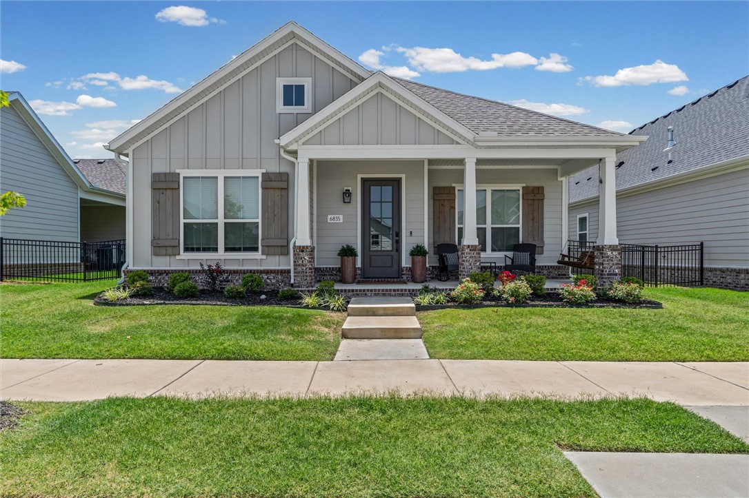 Welcome to this beautiful 4-bedroom, 3-bath home in the desirable Cottages at the Park! Designed with comfort and functionality in mind, this home offers a thoughtfully designed floor plan with spacious living areas, quality finishes, and plenty of natural light throughout. The open-concept living, dining, and kitchen spaces create an inviting atmosphere for both everyday living and entertaining, while the flexible layout provides room for family, guests, or a home office. Enjoy the charm of this low-maintenance community, complete with beautifully maintained grounds and a welcoming neighborhood atmosphere. Just steps away, Shaw Family Park offers miles of walking trails, playgrounds, pickleball and tennis courts, ball fields, dog parks, a splash pad, fitness areas, and picnic pavilions. POA dues include lawn care and landscape maintenance, including mowing, edging, irrigation, mulching, weed control, and maintenance of ornamental landscaping, allowing you to spend more time enjoying your home and the community.