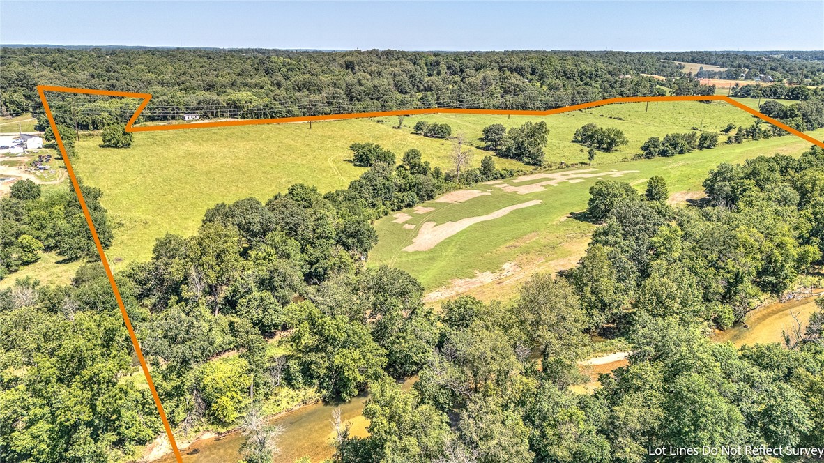 Exceptional 19.68± acre tract located on Haden Road in the desirable Bentonville School District. This open and gently rolling property features a scenic creek running through the land, offering a beautiful natural element and endless possibilities for building, recreation, or agricultural use. With ample space and wide-open views, this property is ideal for a private estate, mini-farm, or future development. Enjoy the balance of peaceful country living with convenient access to Bentonville. A rare opportunity to own acreage with water in a prime location