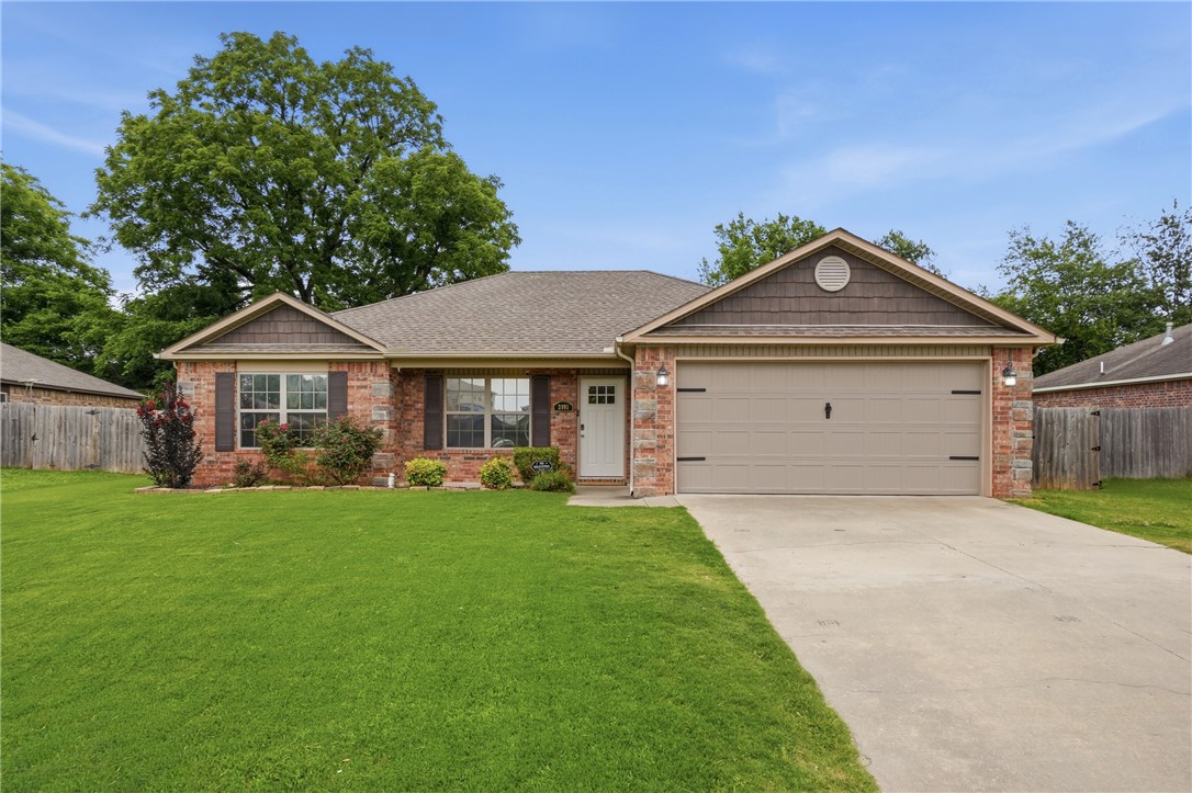 This single-family residence, built in 2014, offers a comfortable and stylish living experience. The heart of this home is an open-plan kitchen, seamlessly connecting with the living room. It is well-appointed with stainless steel appliances, ready for entertaining. The adjacent living room provides a warm ambiance, centered around a welcoming fireplace. Primary bathroom, featuring a double vanity and a convenient walk-in shower. Additional conveniences include a private yard for outdoor enjoyment, a dedicated laundry room, and an attached garage, all contributing to a seamless lifestyle. This property presents a compelling opportunity to embrace comfortable living in Springdale.
