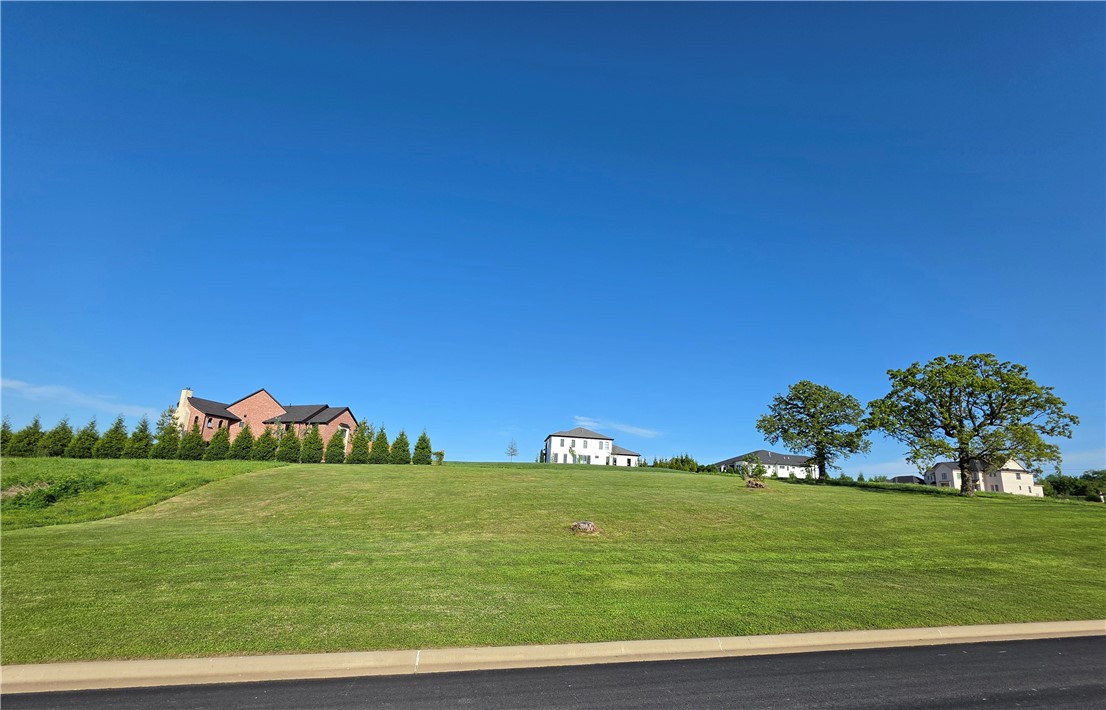 An exceptionally rare opportunity to secure a one-acre homesite within the distinguished enclave of Southgate Estates. Set among some of Rogers’ most architecturally refined residences, this premier property offers a level of privacy, scale, and exclusivity that is increasingly difficult to find. The expansive one-acre setting provides the perfect canvas to design and build a custom estate that reflects both vision and sophistication. Southgate Estates is synonymous with understated luxury—where thoughtfully designed homes, generous spacing, and a sense of arrival define the experience. Perfectly positioned near Pinnacle Hills and just minutes from Bentonville, the location offers seamless access to the region’s finest amenities while maintaining a quiet, elevated lifestyle. Opportunities of this caliber are seldom available, and homesites of this scale within Southgate are becoming increasingly limited. If you or been waiting for the right place to build something extraordinary, this is your future home site.