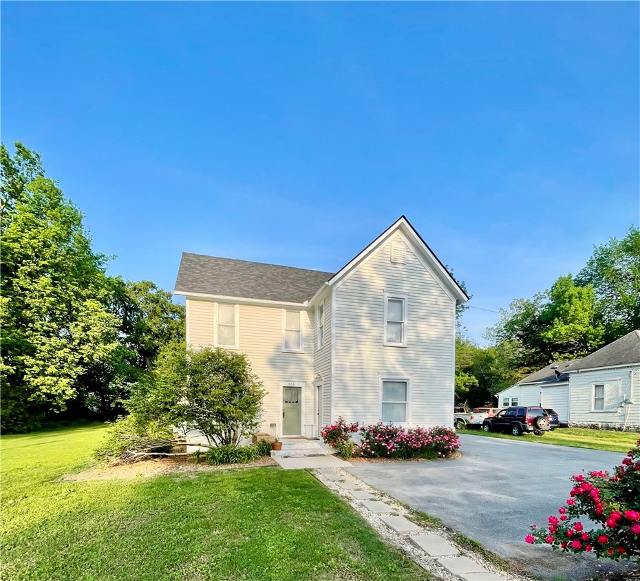 This beautifully remodeled historic farmhouse can solve some real problems — reduce your mortgage through on-property rental income, or keep your family close while everyone maintains their own space.
The main home features three bedrooms, a private one-bedroom in-law suite, refinished original hardwood floors, wood ceilings, and all-new plumbing and utilities throughout.
Behind the house, a Barndominium adds nearly 600 sq ft of independent living space — perfect for parents, adult children, or renters. Finally, at the end of the drive, is a 2 car detached garage that could be used for a workshop or storage.
 All of this sits on a landscaped half-acre shaded by a magnificent ancient oak. Walkable to the library and historic downtown.
Live in the main home. House family in the guest house. Let the Barndominium pay your mortgage. Properties this flexible rarely come to market.